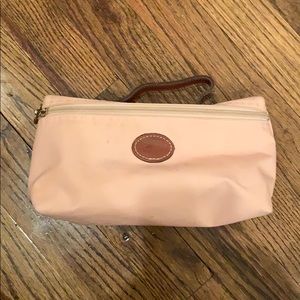 Pale pink Longchamp makeup bag